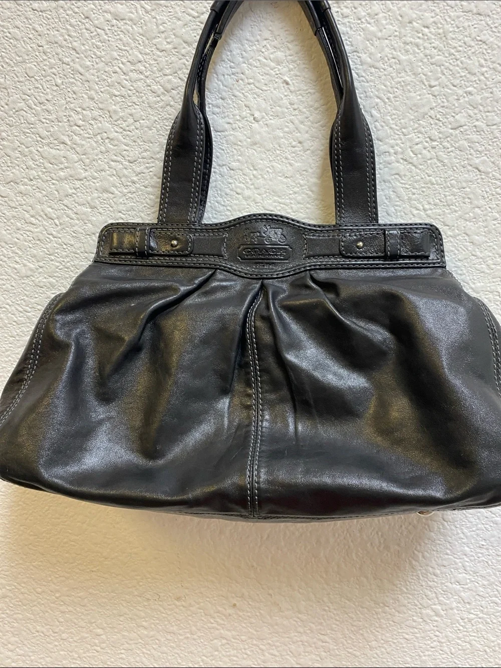 Coach Garnet F13914 pleated shoulder bag with a silver turn lock closure.